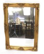 A contemporary gilt framed wall mirror.