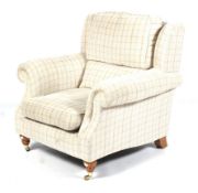 A Parker Knoll chequered oatmeal upholstered armchair.
