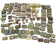 A collection of vintage small product tins.