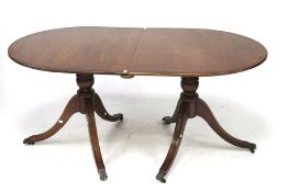 A Regency style D end extending dining table.