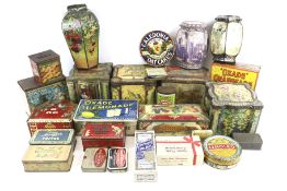 A collection of assorted vintage product advertising tins.