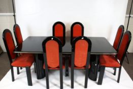 A vintage dining table and eight chairs.