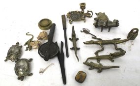 Interesting collection of antique brass and metal items to include nutcrackers and candlestick. Max.