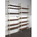 A mid-century Ladderax teak and metal shelving system.