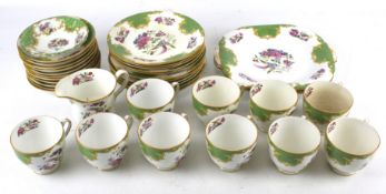 A J&G Grovenor 'Ye Old English' tea service for ten. Including two sandwich plates, saucers, etc.