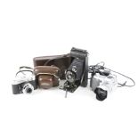 Three vintage cameras. Comprising a digital Minolta Dinage 5 with charge lead, 7.2-50.