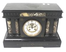 A substantial Victorian black slate and marble mantel clock.