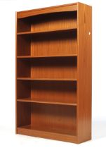 A freestanding bookcase with three adjustable shelves.