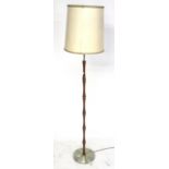 A 1960s standard lamp. Teak and metal on a round base.