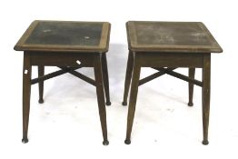 A near pair of wooden tables.
