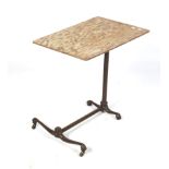 A vintage adjustable and tilt top overbed table. Cast metal base with ball and claw feet.