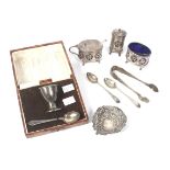 A silver cruet set and christening set.