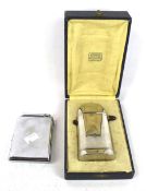An item of French Medical equipment and Colibri cigarette case and lighter.
