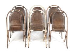 A set of six mid-century vintage industrial stacking chairs.