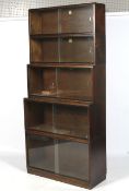 A vintage Simplex five section display bookcase. With sliding glass doors.