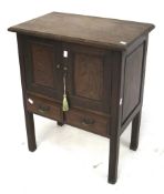A mahogany cupboard with two drawers. With panelled doors and on square supports.