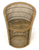 A vintage retro wicker rattan conservatory tub chair.