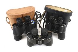 Three pairs of binoculars.