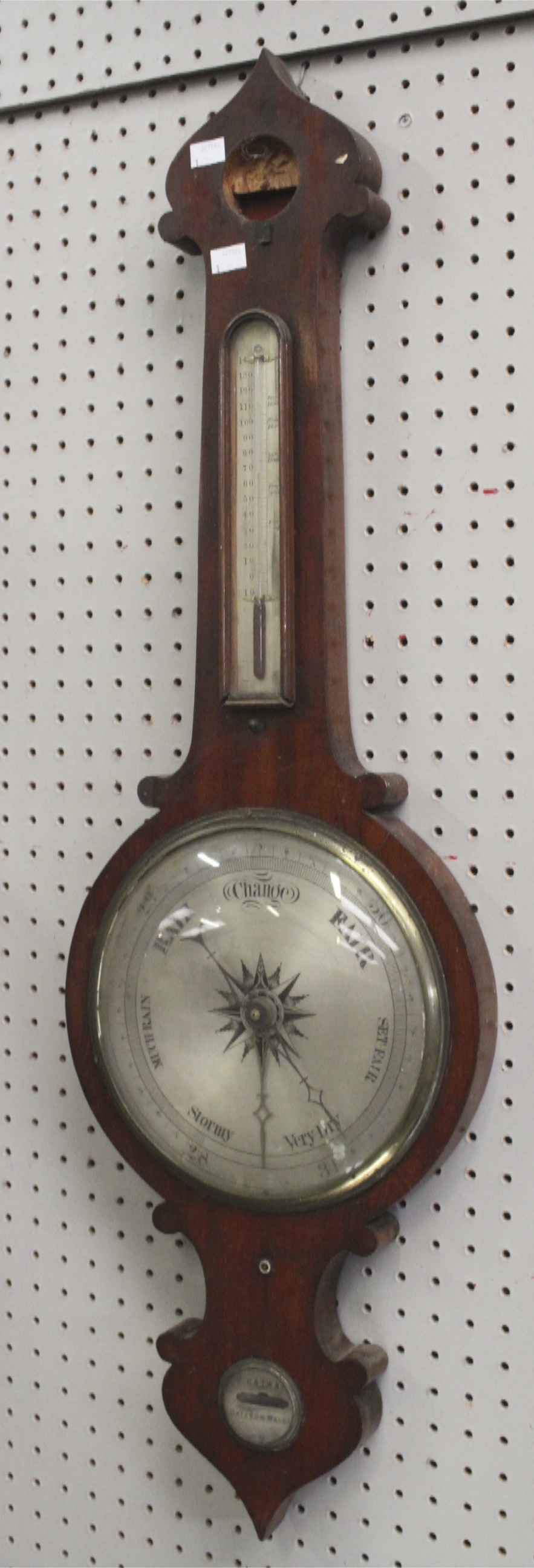 A Victorian mahogany cased banjo barometer.