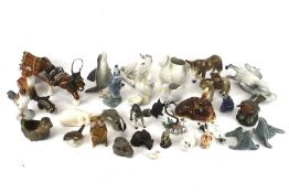 A collection of assorted ceramic figures of animal. Including sea lions, birds, etc. Max.