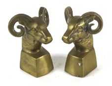 A pair of brass ram's head bookends.