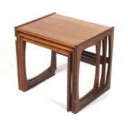 A mid-century G Plan (red label) nest of three teak tables. Max.