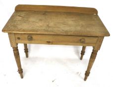 A vintage pine wash stand side table. With single drawer on turned tapering supports.