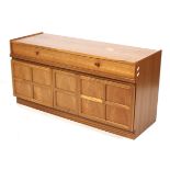 A mid-century Nathan teak sideboard. Two drawers above two cupboards with a central two tier drawer.
