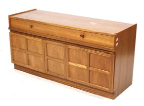 A mid-century Nathan teak sideboard. Two drawers above two cupboards with a central two tier drawer.