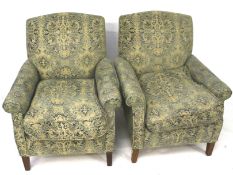 A pair of contemporary armchairs.
