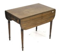 A mahogany drop leaf table. On turned tapering supports. L84cm x D52cm x H66.