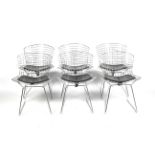 A set of six Henry Bertoia side chairs. Chrome wirework chairs with seat pads.
