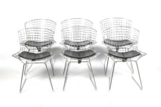 A set of six Henry Bertoia side chairs. Chrome wirework chairs with seat pads.