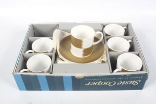 A vintage Susie Cooper 'Heraldry-Old-Gold' coffee set.