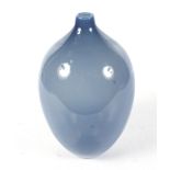 A hand blown sky blue glass vase.
