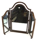 A triple folding dressing swing mirror.