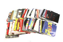 A collection of assorted 45 RPM 7" vinyl record singles.