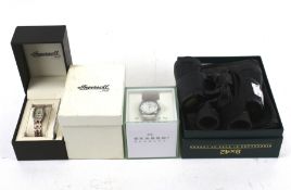 Two assorted wristwatches and a pair of binoculars.
