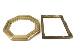 Two 20th century gilt framed wall mirrors. One of octagonal form with blue details, diameter 42.