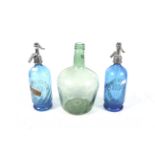 Two blue glass soda syphons and a green glass bottle Condition Report: All appear