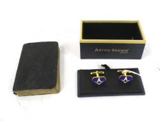 A Masonic handbook and a boxed pair of Aston Brown cufflinks.