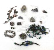 An assortment of jewellery. Including brooches, pairs of earrings, necklaces, etc.