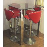 A set of four adjustable red vinyl kitchen stools and a glass top table.