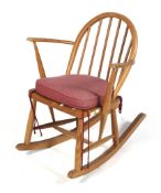 A vintage Ercol child's bentwood rocking chair.