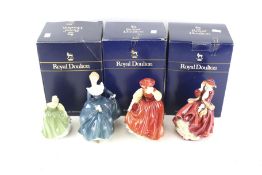 Four Royal Doulton figures.