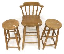 Three assorted pine kitchen and bar stools.