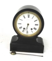 A 20th century mantel clock. The white enamel dial with Roman numerals, in a black slate case, H34.