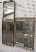 Two contemporary rectangular wall mirrors. One with a black and gilt frame, 94.5cm x 33.