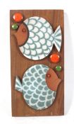 A Hornsea Muramic handcrafted wall plaque. 'Fish' designed by John Clappison, 20cm x 10cm (AF).