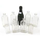 A collection of vintage glass medicine bottles.